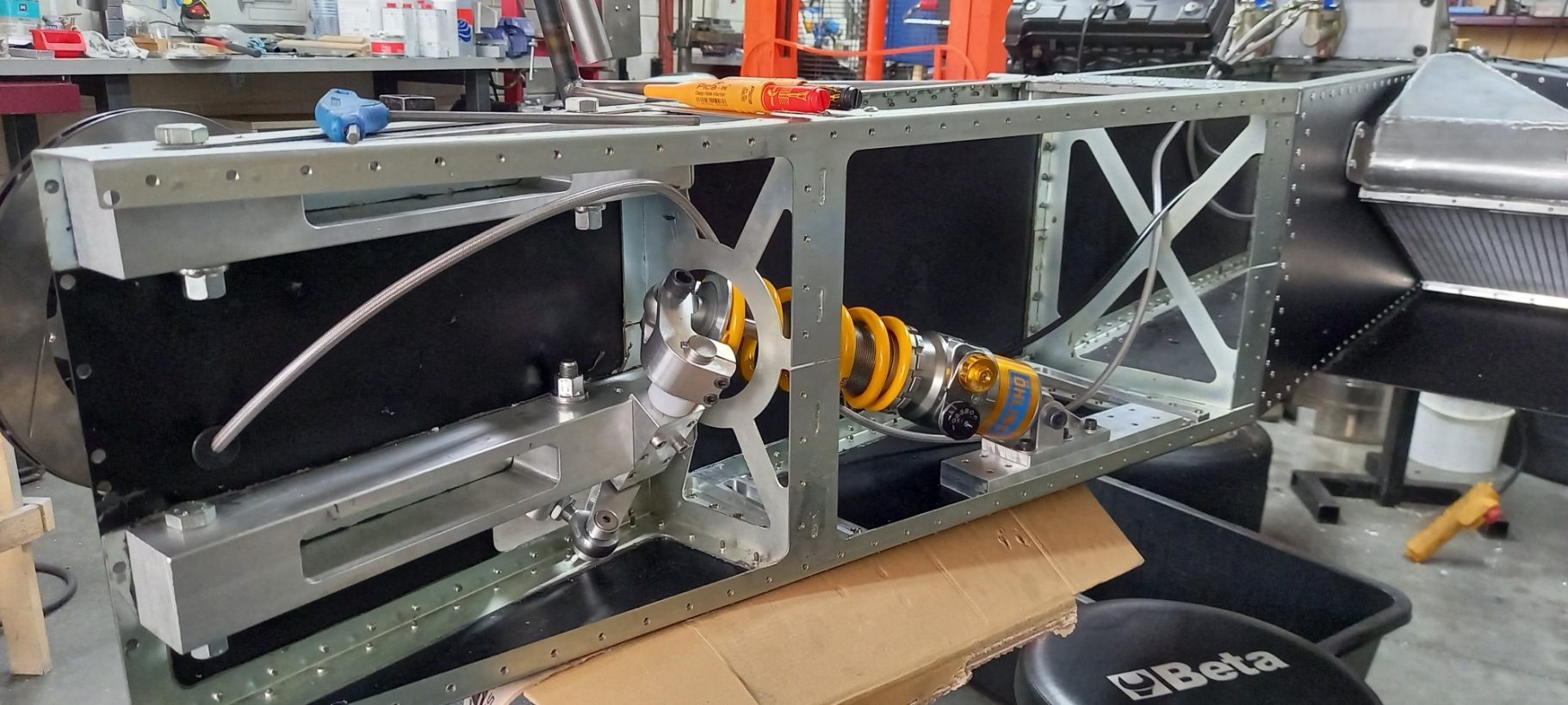 Progresieve tuimelaar veersysteem